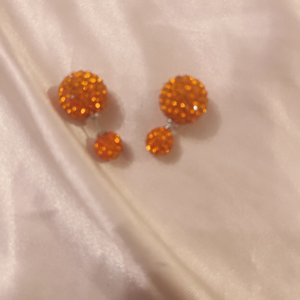 Orange rhinestone disco ball sparkle on both sides post earrings.